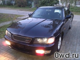 Битый автомобиль Nissan Laurel