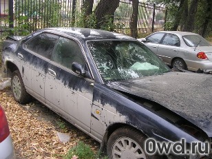 Битый автомобиль Nissan Laurel